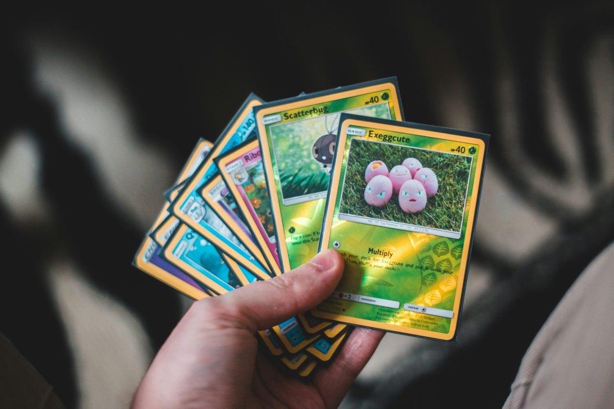 Pokemon trading cards spread on a table