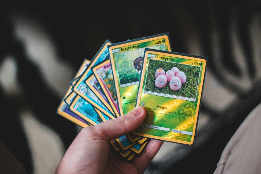 Pokemon trading cards spread on a table