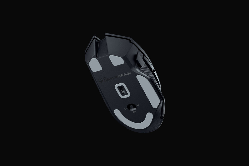 Underside of the Razer Basilisk V3 X HyperSpeed in Black, showing the PTFE mouse feet, optical sensor and the 2.4 GHz, Bluetooth and off switch