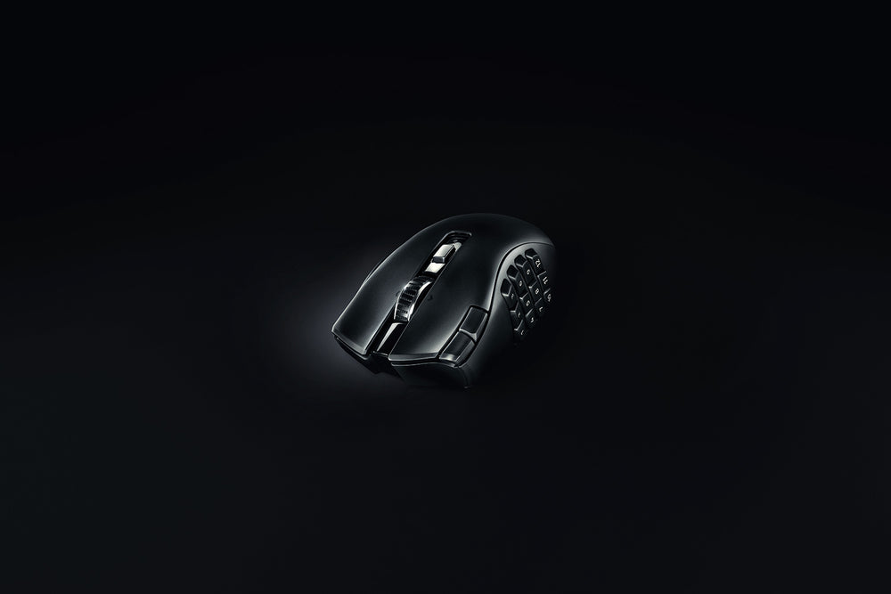 Razer Naga V2 HyperSpeed in Black from the front left on a dark background, showing the thumb grid and the main buttons