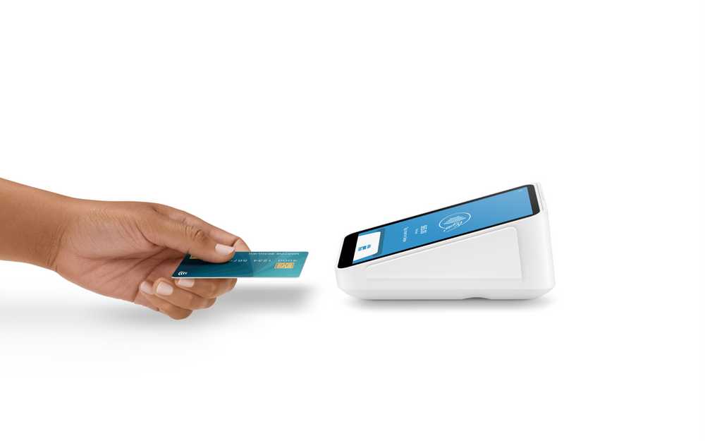 Customer inserting a chip card into the front slot of the Square Terminal