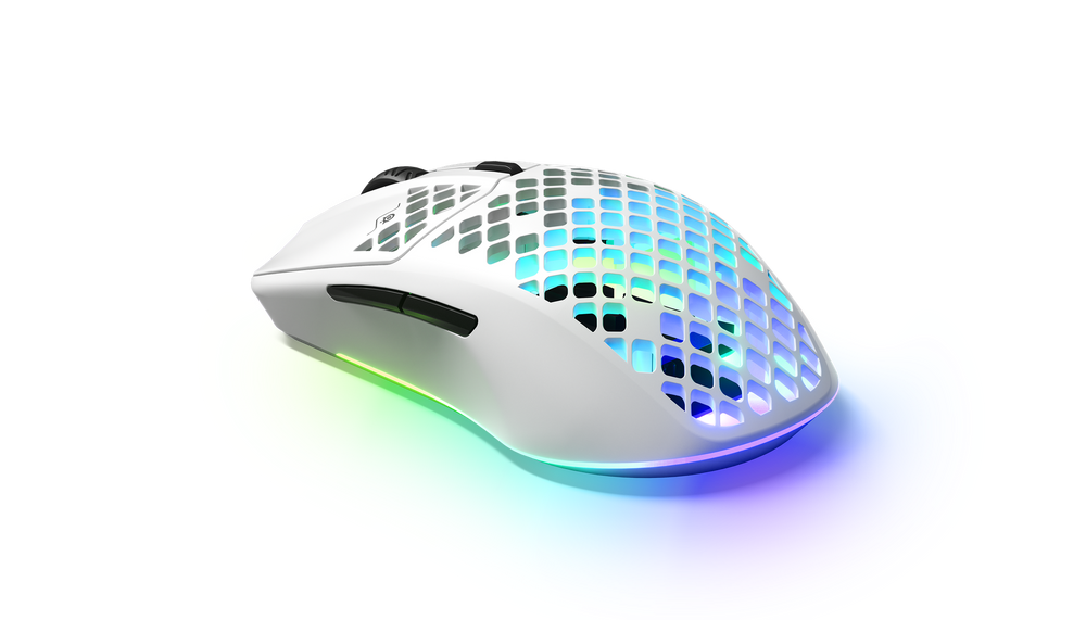 SteelSeries Aerox 3 Wireless in Snow at an angle from the left, with RGB glowing through the perforated shell