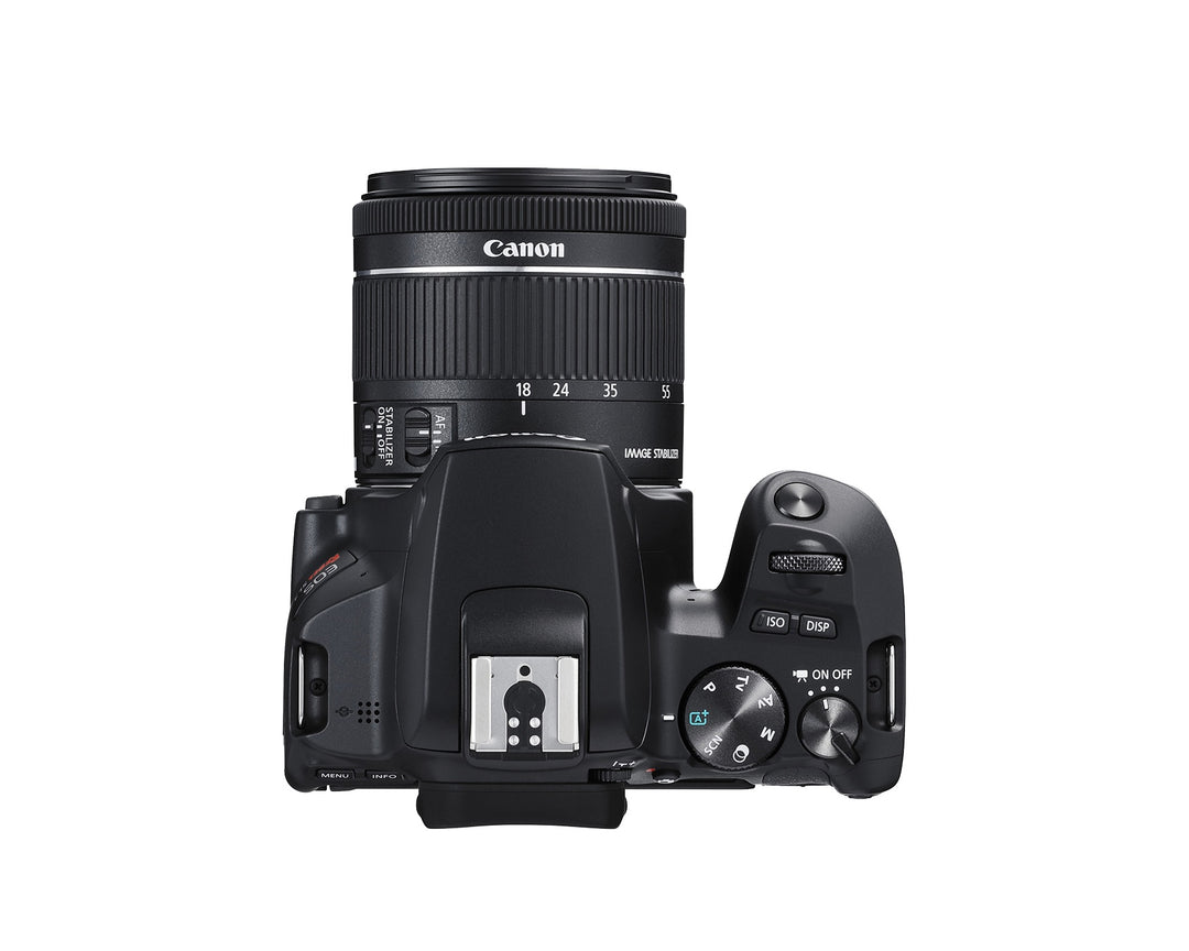 Top of the Canon EOS Rebel SL3 showing the mode dial, power switch, hot shoe and 18-55mm zoom ring