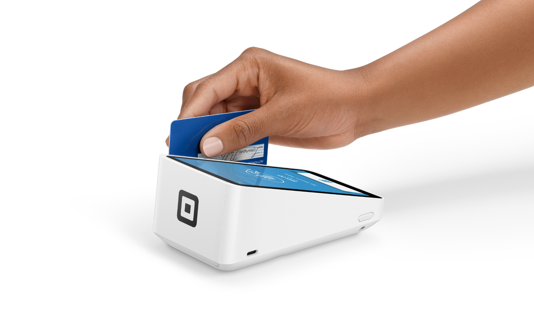 Customer tapping a contactless card on the Square Terminal screen, back view with the Square logo