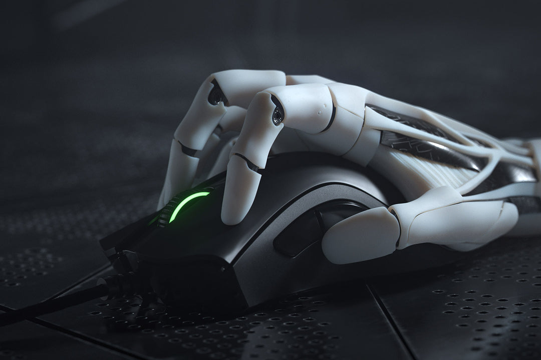Close-up of the Razer DeathAdder V2 in Black held by a white robotic hand