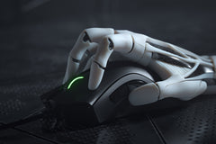 Close-up of the Razer DeathAdder V2 in Black held by a white robotic hand