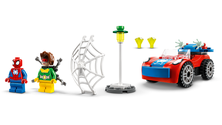 All set components laid out: car, Spidey and Doc Ock minifigures, web elements, lamppost and diamonds