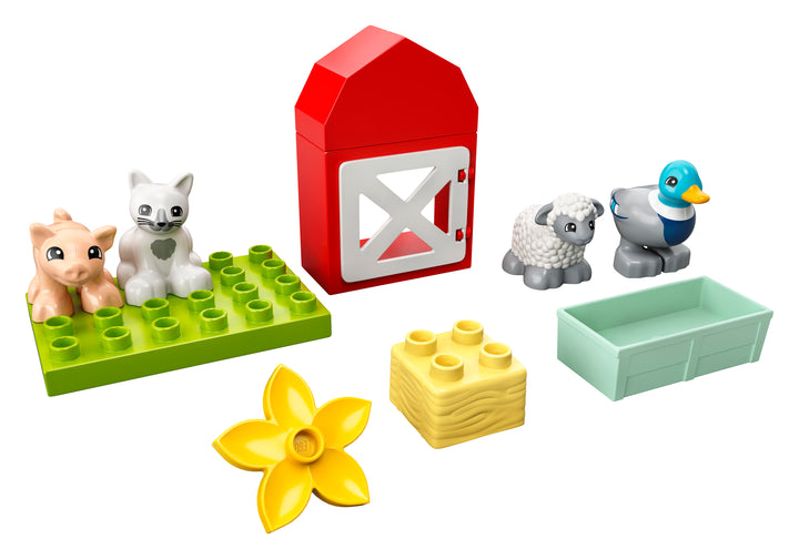 Full LEGO DUPLO Farm Animal Care set contents: barn, pig, sheep, duck, cat and hay bale on white background