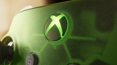 XBOX Wireless Controller X25 Special Edition, close-up of the lit green XBOX button