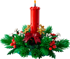 Built LEGO Christmas Table Decoration: a red candle with red berries, golden stars and green foliage on white background