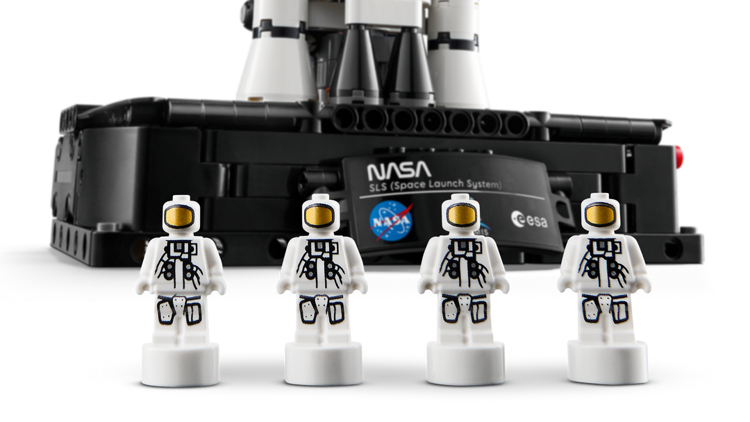 LEGO Technic NASA Artemis Space Launch System Rocket 42221, 4 astronaut nanofigures in front of the NASA panel