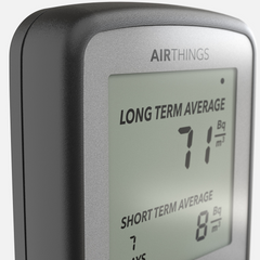 Close-up of the Airthings Corentium Home screen with Long Term Average and Short Term Average readings in Bq/m³