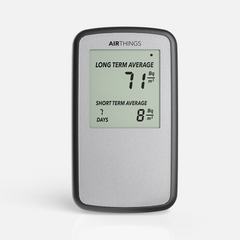 Airthings Corentium Home digital radon detector, front view, screen showing the long term and short term radon averages in Bq/m³