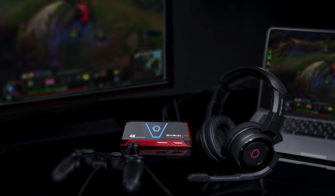 AVerMedia Live Gamer Portable 2 Plus beside a gaming headset and controller in a console streaming setup
