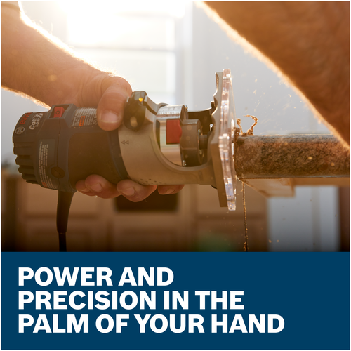 Close-up of the Bosch Colt PR20EVS held in one hand while routing a board edge