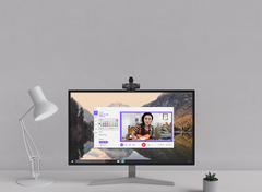 Logitech C920s Pro HD Webcam on a desktop monitor showing Logi Tune webcam settings during a video call