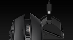 Logitech G502 LIGHTSPEED with the charging and data cable connected at the front