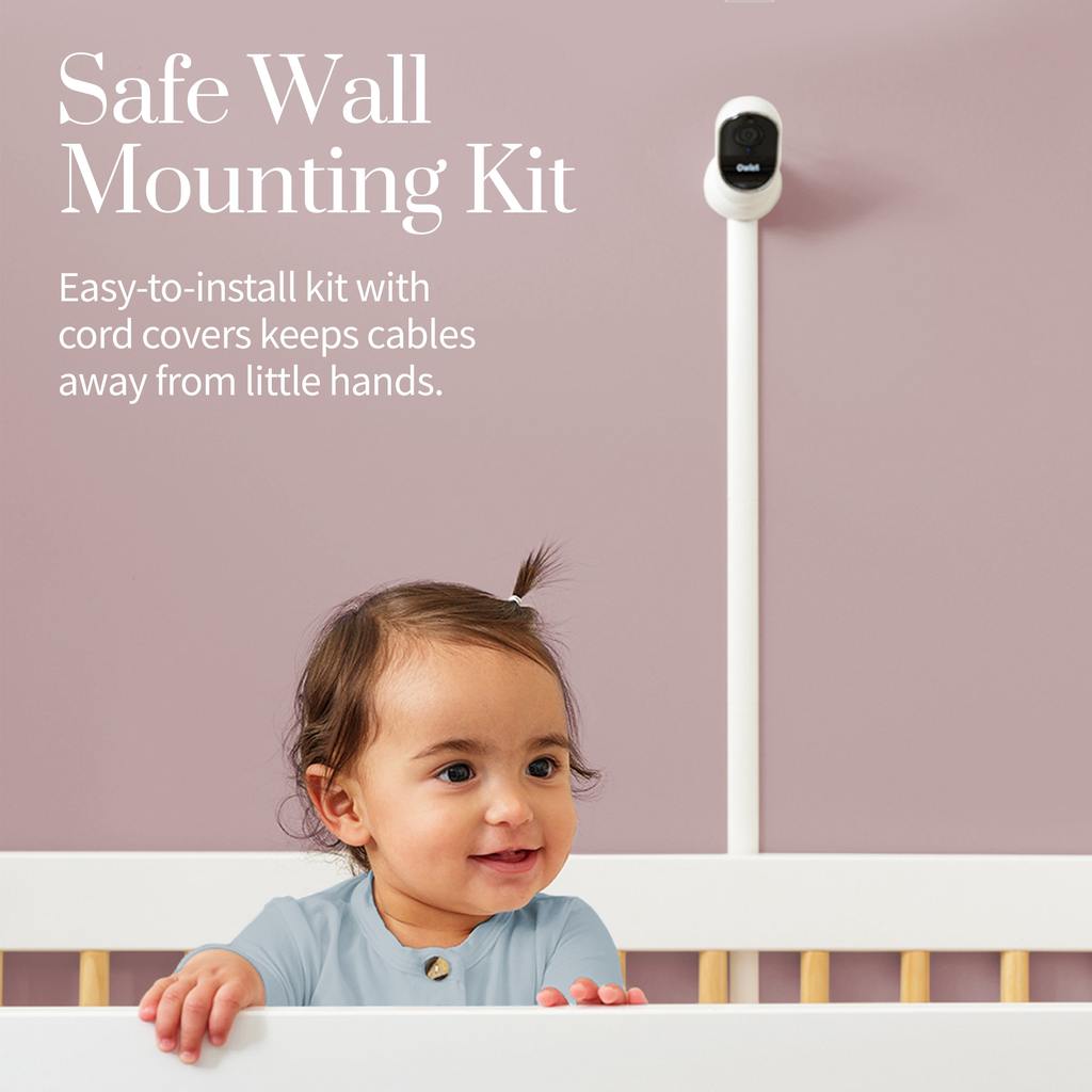 Owlet Cam from the Monitor Duo mounted on the wall above a crib with the included wall mounting kit and cable guards