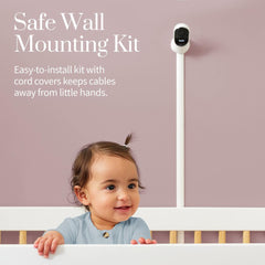 Owlet Cam from the Monitor Duo mounted on the wall above a crib with the included wall mounting kit and cable guards
