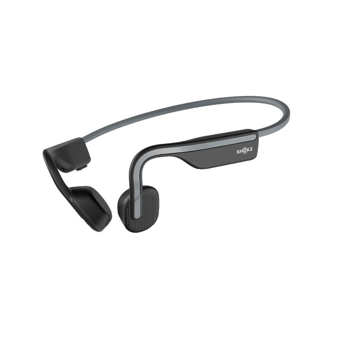 Shokz OpenMove bone conduction headphones in Slate Grey, three-quarter view of the titanium band and transducers