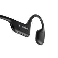 Close-up of the Shokz OpenRun Pro black battery housing with the magnetic charging port, LED and volume buttons