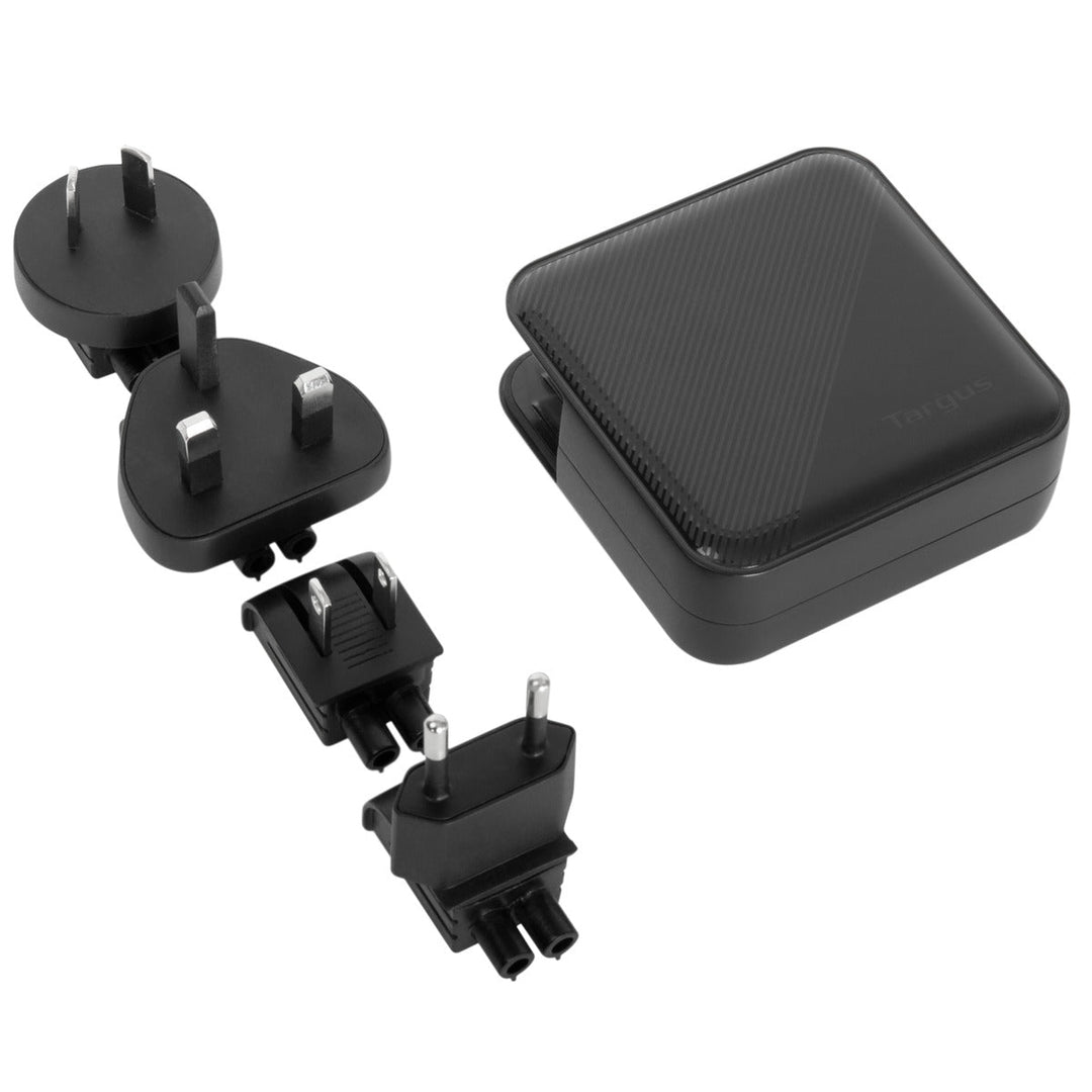 Targus PowerElite 100W GaN charger with its four interchangeable plug heads: AU, UK, US and EU