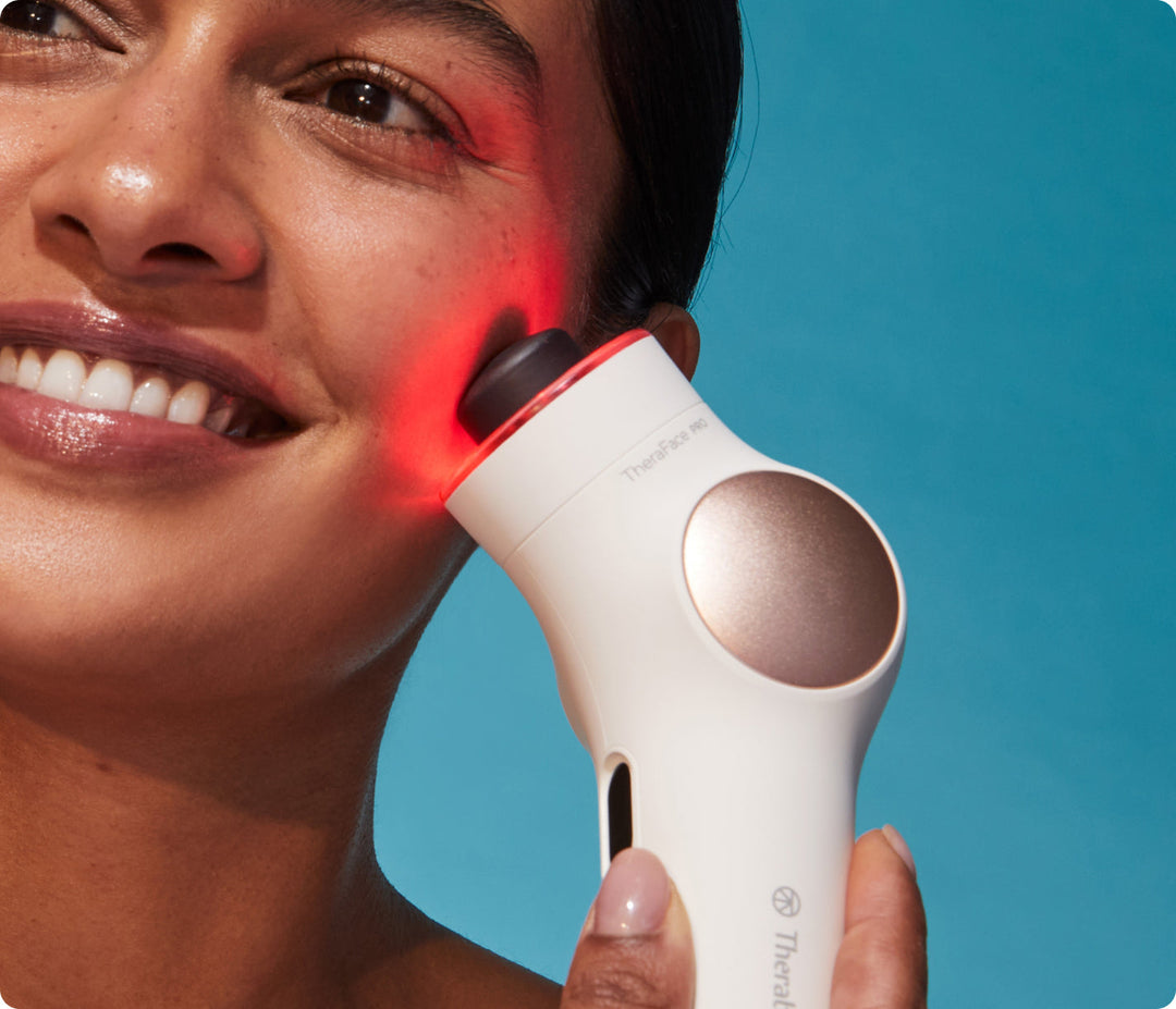 TheraFace PRO white in use on the cheek with red LED light therapy