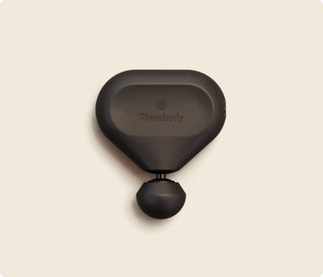 Therabody Theragun Mini 2nd Gen massage gun in black with the Standard Ball attachment, front view