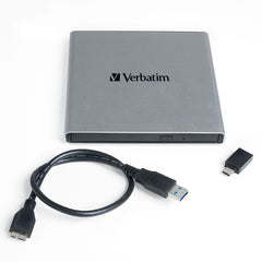 Verbatim External All-in-One Optical Writer with its USB-A cable and USB-A to USB-C adapter laid out beside the drive