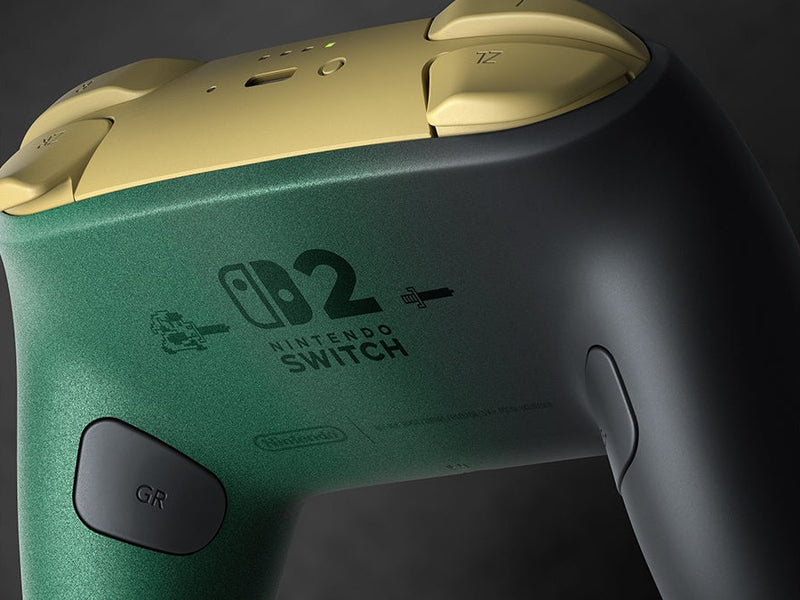 Close-up of the back of the Zelda 40th Anniversary Pro Controller: pixel-art Link, the Switch 2 logo and the GR button